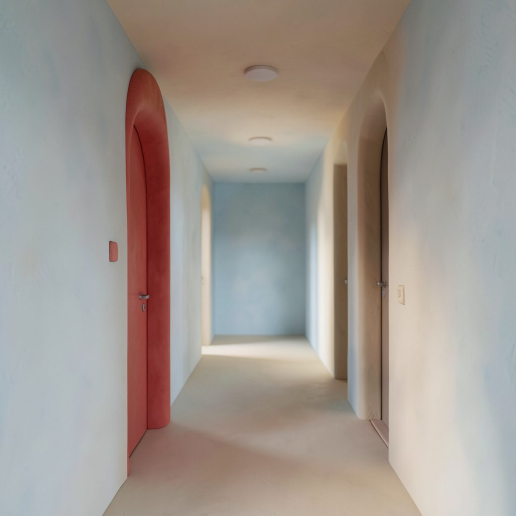 A quiet hallway with soft clay-like walls in pale blues and creams, conveying calm and steady progress.