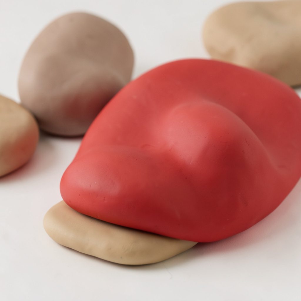 Soft clay-model render of rounded abstract organic forms in muted teal and warm terracotta, suggesting cellular renewal and gentle healing.